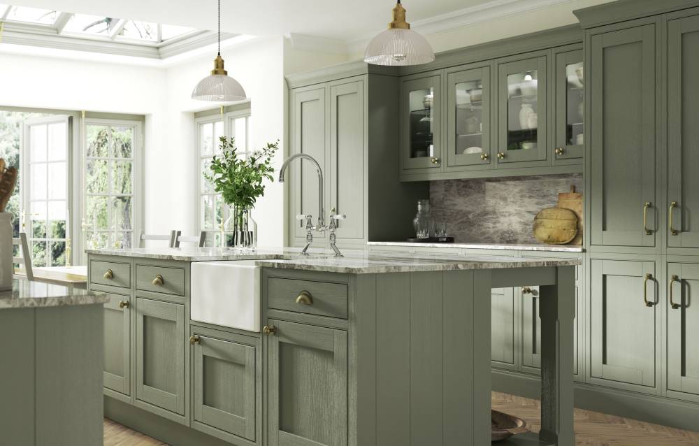 Timeless Kitchen with pale-green door-fronts and wooden worktops.