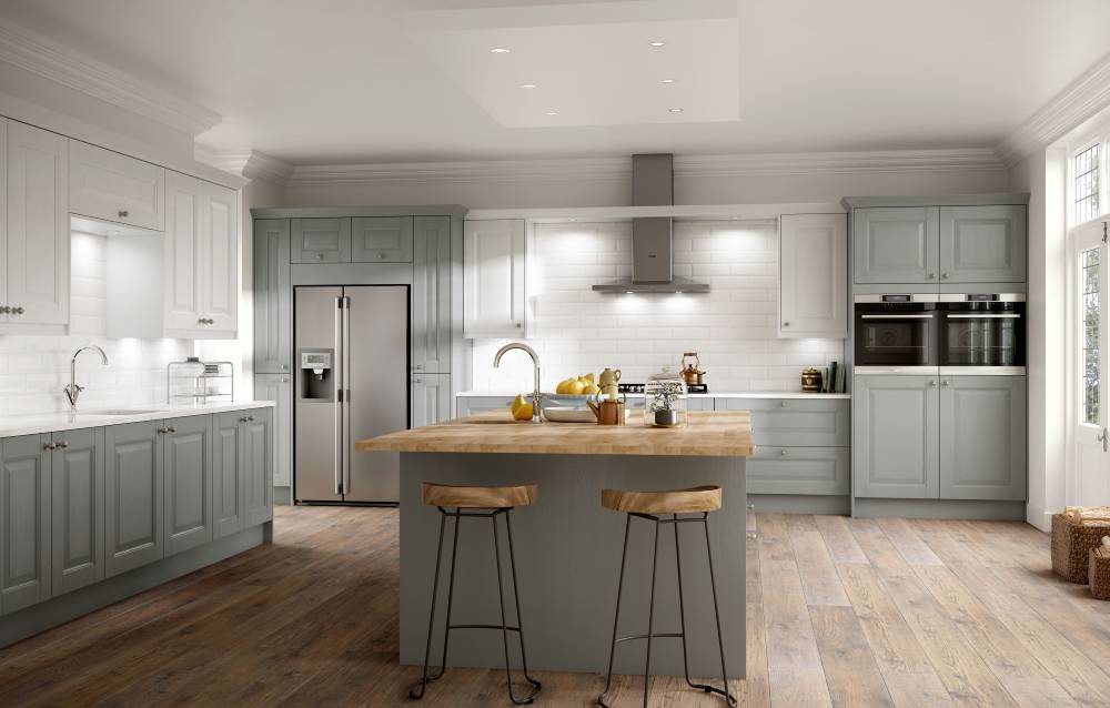 Traditional Kitchen with wood door-fronts and white worktops.